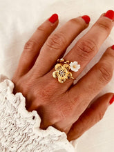 Load image into Gallery viewer, Nalani gold open statement ring with natural shell flower and sparkling zircon accents worn on hand