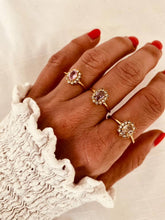 Load image into Gallery viewer, Nedra gold-plated ring featuring a sparkling oval zircon surrounded by delicate floral details worn on hand