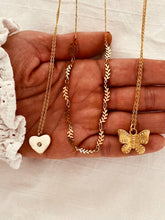 Load image into Gallery viewer, Romantic gold heart necklace styled for everyday and evening outfits