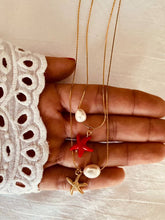 Load image into Gallery viewer, Summer layered stainless steel necklace with red and gold starfish pendants paired with freshwater pearls displayed in a balanced double chain design