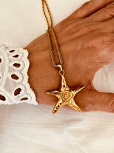 Load image into Gallery viewer, Starfish pendant necklace with textured spiral design on stainless steel chain