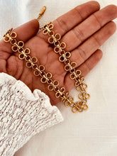 Load image into Gallery viewer, Close-up of vintage round skeleton hollow chain necklace crafted from stainless steel with waterproof, tarnish-resistant finish and polished shine.