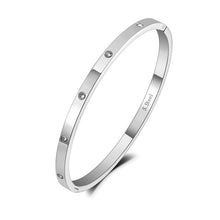 Load image into Gallery viewer, Silver zircon bangle bracelet highlighting minimalist elegant jewelry look