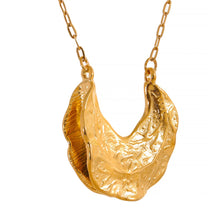 Load image into Gallery viewer, Close up of crescent moon pendant with irregular textured surface