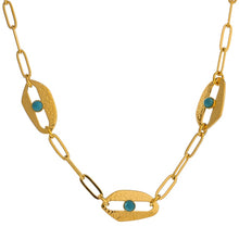 Load image into Gallery viewer, Close-up of gold plated evil eye necklace showing three eye charms with blue stones