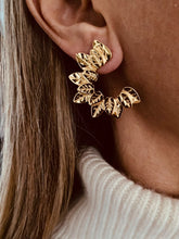 Učitaj sliku u preglednik galerije, Make a bold statement with these creative heavy metal leaf earrings, designed to stand out with a unique, edgy charm. Crafted from high-quality stainless steel, they are waterproof, rust-resistant, and built for long-lasting shine. Perfect for parties, vacations, or elevating everyday outfits, these earrings add a striking artistic touch that effortlessly blends modern style with durable elegance.
