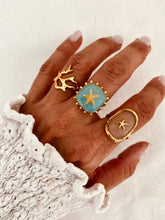 Load image into Gallery viewer, Adjustable gold ring designed with a starfish motif and vibrant turquoise centre
