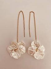 Load image into Gallery viewer, Close-up of BIANKA earrings highlighting the textured pearl flower and long gold threader chain for graceful movement.
