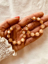Učitaj sliku u preglednik galerije, Beige resin bead C-shape huggie earrings with stainless steel chain showcasing minimalist neutral toned handmade jewelry design
