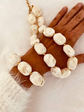 Load image into Gallery viewer, Chunky ivory necklace worn on the model.

