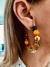 Učitaj sliku u preglednik galerije, Multicolor resin bead huggie earrings styled with outfit showing bold trendy fashion jewelry for everyday wear
