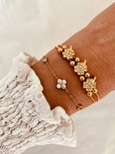 Load image into Gallery viewer, Clover zircon bracelet layered with other jewelry showing delicate stacking style
