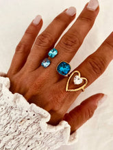 Load image into Gallery viewer, Women's gold plated ring featuring an open heart silhouette and sparkling crystal
