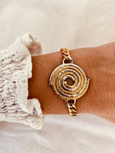 Load image into Gallery viewer, Close-up of disc bracelet capturing smooth finish and refined shine
