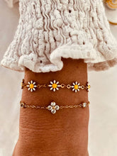 Load image into Gallery viewer, Daisy bracelet styled with casual outfit highlighting playful feminine jewelry
