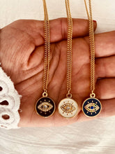 Load image into Gallery viewer, Macro shot of cubic zirconia evil eye pendant capturing light reflection and fine detailing for high-end jewelry presentation
