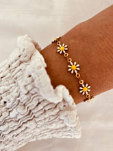 Load image into Gallery viewer, Daisy bracelet styled with outfit demonstrating cheerful everyday jewelry style
