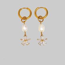 Učitaj sliku u preglednik galerije, Close-up of pearl flower earrings with zircon accents showcasing delicate craftsmanship and sparkling luxury finish
