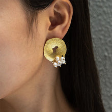 Load image into Gallery viewer, Hammered pearl earrings styled with outfit emphasizing romantic French inspired fashion jewelry aesthetic
