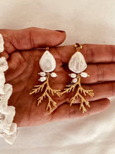 Load image into Gallery viewer, Freshwater pearl coral-inspired earrings on hand
