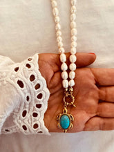 Load image into Gallery viewer, Freshwater pearl necklace with gold turtle charm close-up highlighting natural pearl texture and elegant ocean jewelry design
