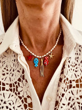 Load image into Gallery viewer, Freshwater pearl necklace worn on the neck with colourful sea charms creating a playful summer look.
