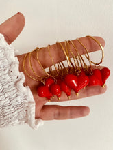 Load image into Gallery viewer, Hollow circle and heart drop earrings captured in motion highlighting lightweight design and elegant movement
