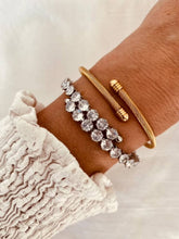 Load image into Gallery viewer, Gold open bangle styled with outfit demonstrating elegant everyday jewelry style
