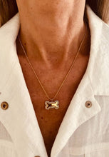 Load image into Gallery viewer, Elegant gold necklace with a bone-shaped pendant and zircon stones, perfect as a thoughtful gift for dog moms and pet lovers.

