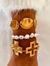 Load image into Gallery viewer, Women's gold bracelet with organic textured details.
