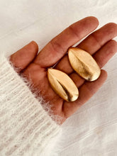 Load image into Gallery viewer, FEDELLA leaf statement earrings in gold stainless steel.
