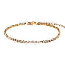 Load image into Gallery viewer, Gold zircon tennis bracelet in stainless steel shown from front angle highlighting sparkling elegant jewelry design
