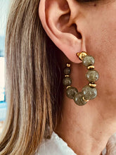 Učitaj sliku u preglednik galerije, Shimmering green resin bead earrings styled with outfit emphasizing elegant modern statement jewelry aesthetic
