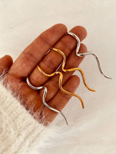Load image into Gallery viewer, HERMA organic wave statement earrings in gold stainless steel.
