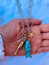 Load image into Gallery viewer, ISLA layered necklace with turquoise fish, gold fish and starfish charms crafted from gold plated stainless steel.

