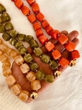 Load image into Gallery viewer, IZZA Marble necklace collection photographed together, featuring four contemporary resin bead colourways.
