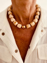 Load image into Gallery viewer, Cream Marble statement necklace with oversized glossy resin beads and a polished gold centre bead designed for effortless everyday styling.
