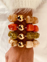 Load image into Gallery viewer, IZZA marble bracelet collection featuring Cream Marble, Olive Marble, Taupe Marble and Coral Marble resin bracelets with polished gold centre beads.
