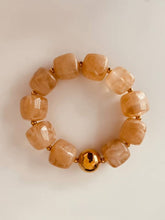 Load image into Gallery viewer, IZZA Taupe Marble bracelet showcasing warm taupe marbled resin beads with a luxurious polished gold centre bead.
