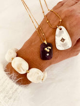 Load image into Gallery viewer, Elegant ivory bracelet with gold-plated accents.
