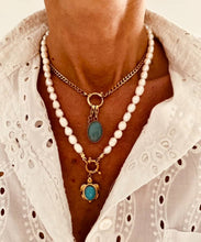 Load image into Gallery viewer, Freshwater pearl necklace layered with gold chain necklace styled on neck for modern ocean inspired jewelry look
