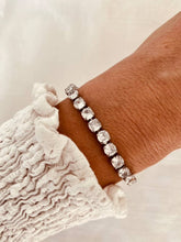 Load image into Gallery viewer, Gold zircon bracelet styled with outfit demonstrating elegant everyday jewelry style
