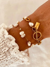 Load image into Gallery viewer, Minimal pearl bracelet worn on wrist demonstrating soft elegant everyday jewelry styling
