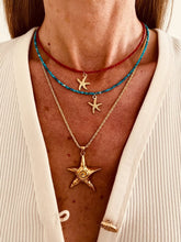 Load image into Gallery viewer, Summer necklace with faceted rhinestone beads and a gold starfish.
