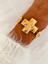 Load image into Gallery viewer, Statement cross bracelet worn on the wrist.
