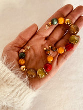 Učitaj sliku u preglednik galerije, Close-up of colorful glossy resin beads highlighting vibrant tones and modern handmade fashion jewelry craftsmanship
