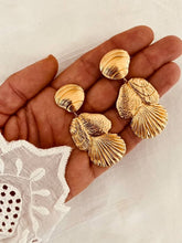 Load image into Gallery viewer, Close-up of textured shell earrings inspired by the Mediterranean.
