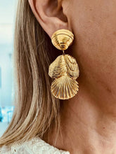 Load image into Gallery viewer, NIL statement earrings featuring layered gold seashells.
