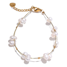 Load image into Gallery viewer, Freshwater pearl bracelet on wrist against neutral background showing clean minimalist aesthetic

