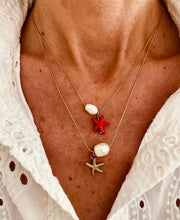 Load image into Gallery viewer, Close-up of pearl and starfish necklace capturing shine and refined detail
